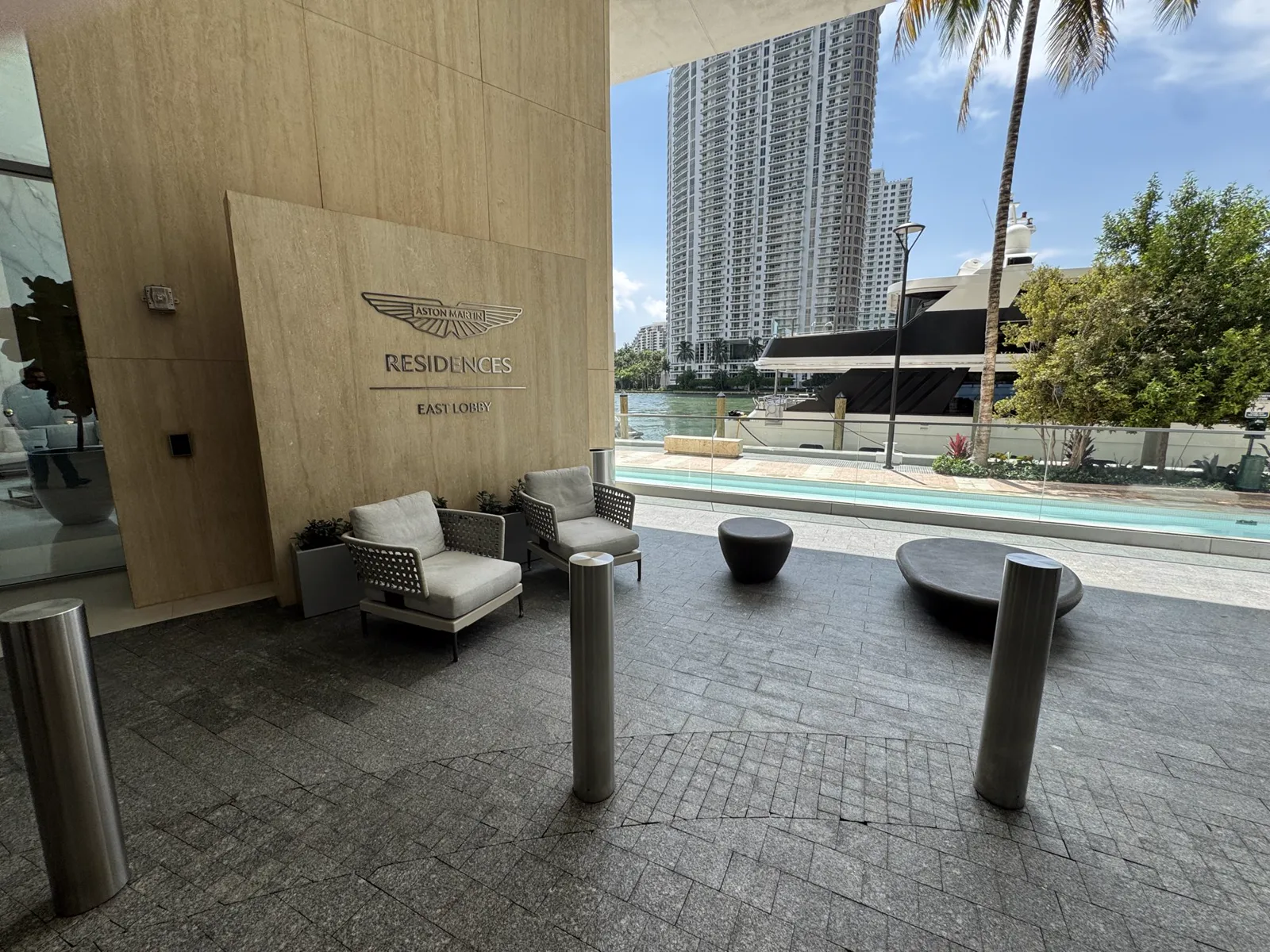 Waterfront lobby seating and pool area at Aston Martin Residences in Miami