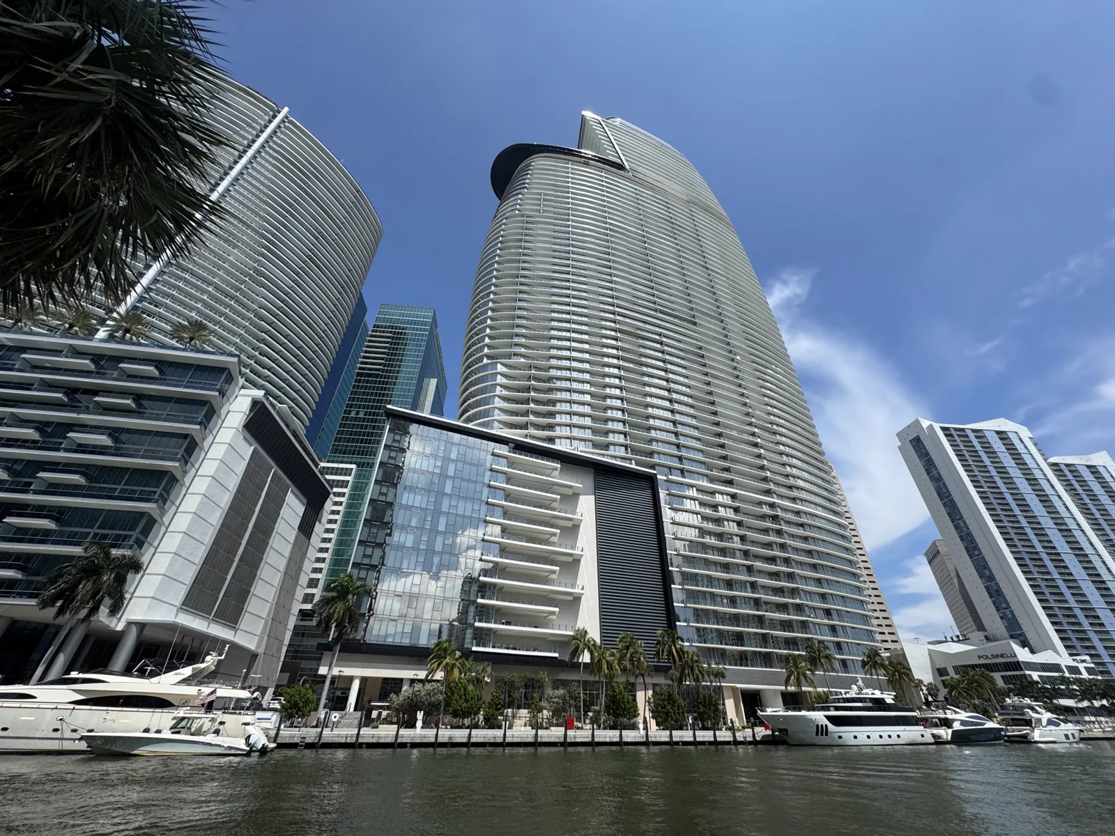 Aston Martin Residences tower on the Miami waterfront with yachts in the foreground