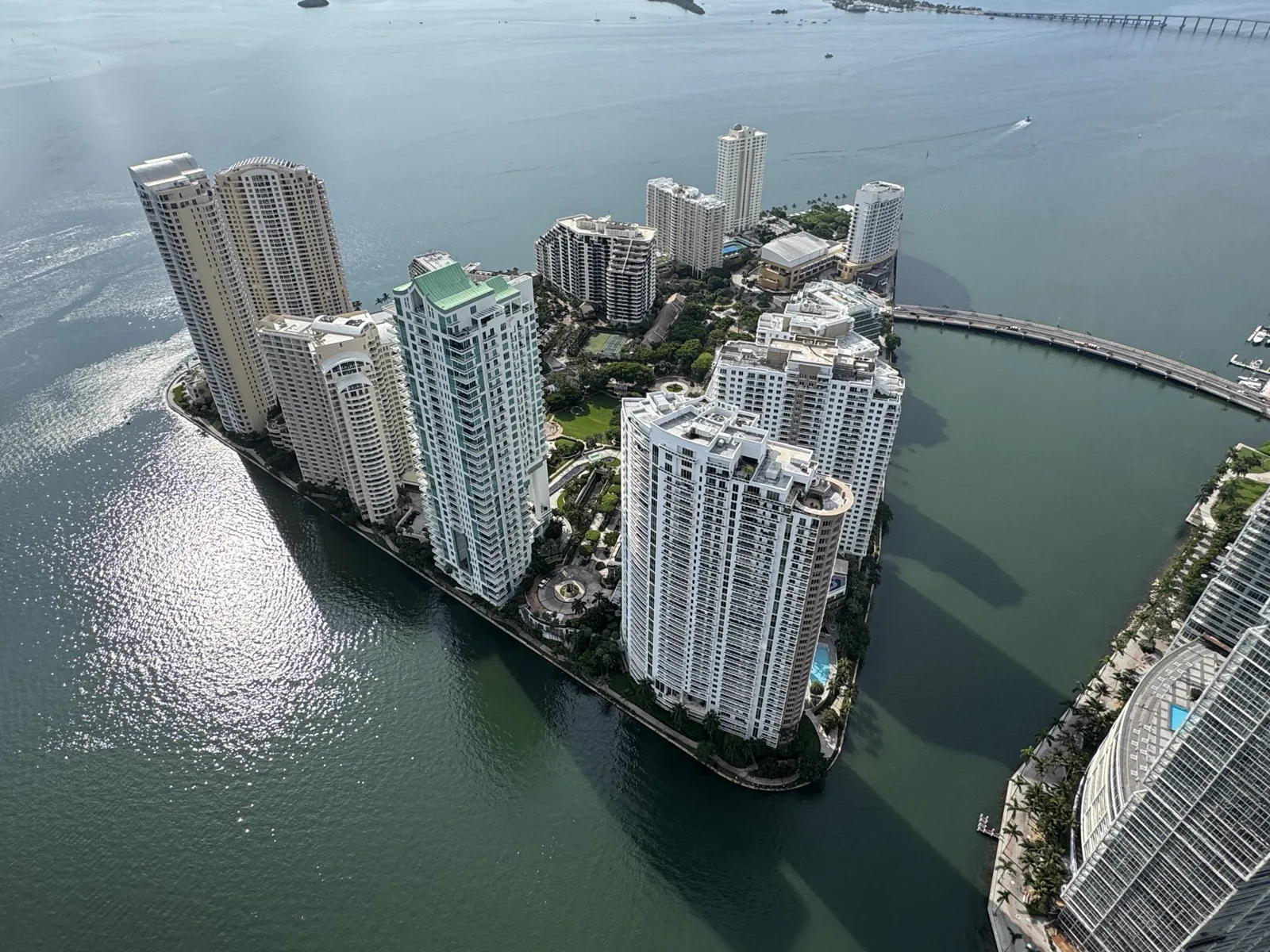 Aerial view of Brickell Key high-rise buildings surrounded by Biscayne Bay